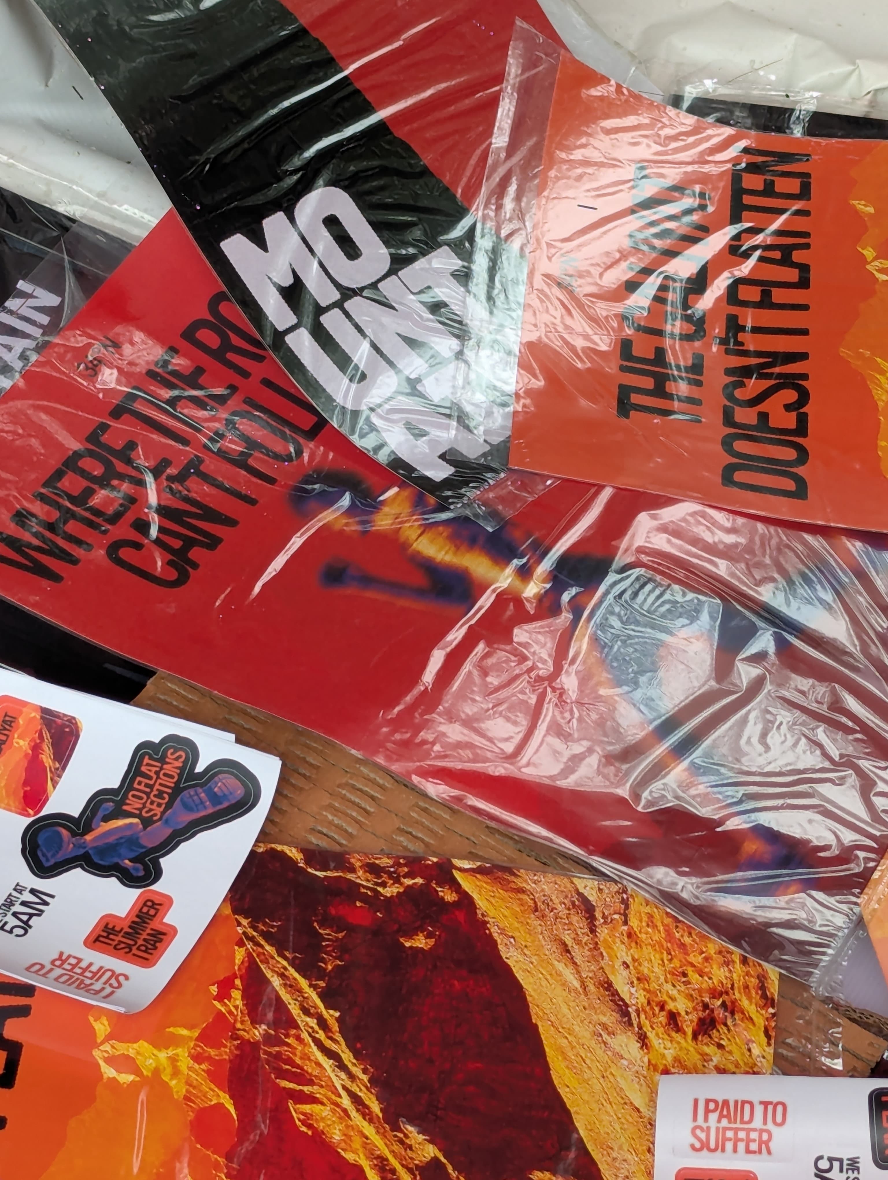 Peak race posters and stickers arranged together