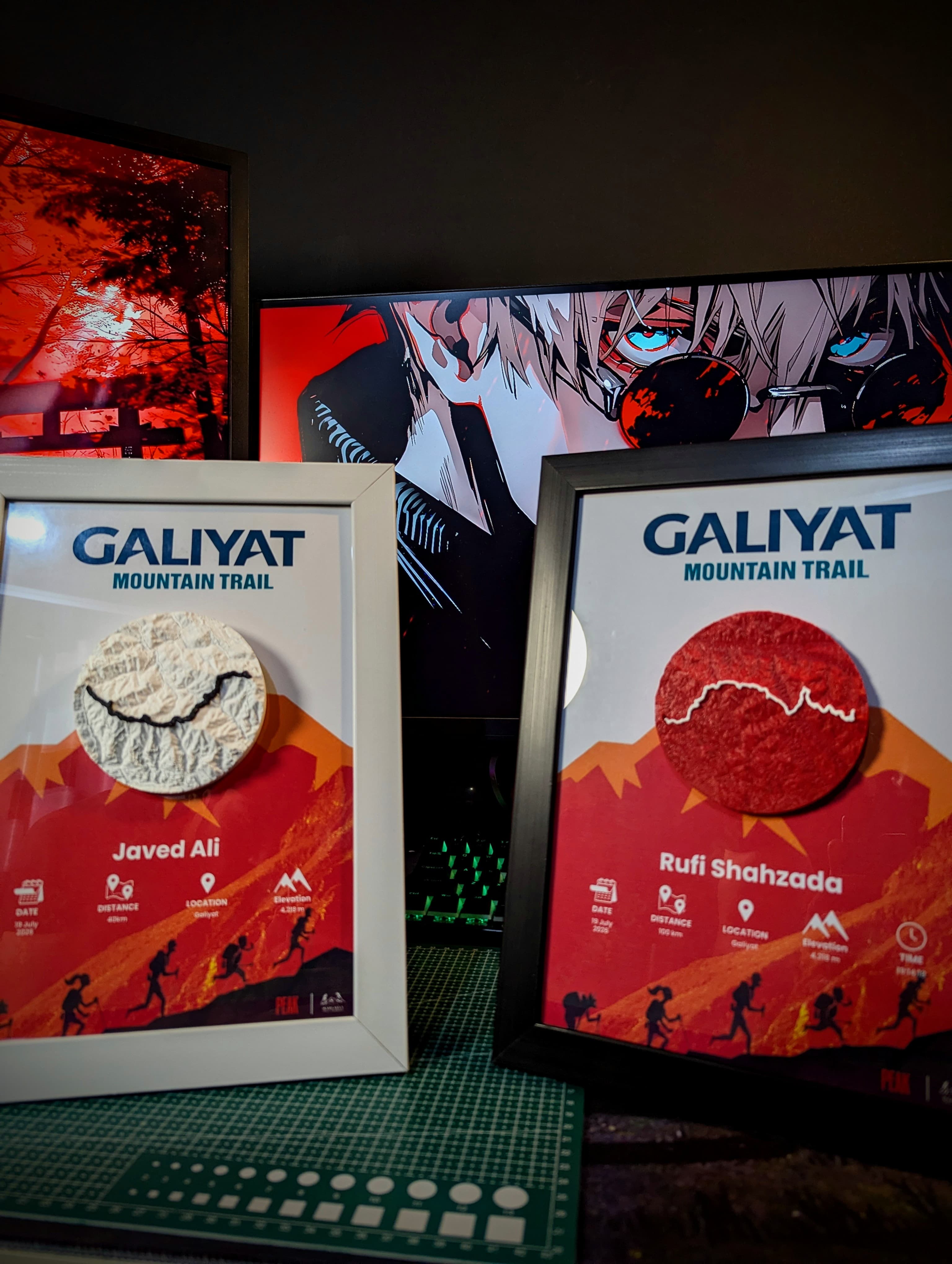 Two Galiyat Mountain Trail frames under red studio light